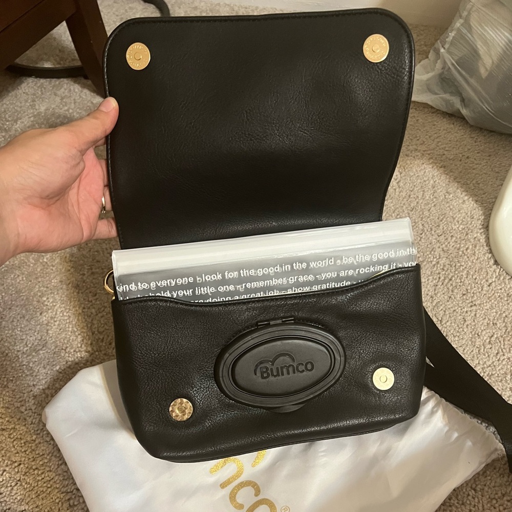 Black BUMCO wipe bag. New without tags